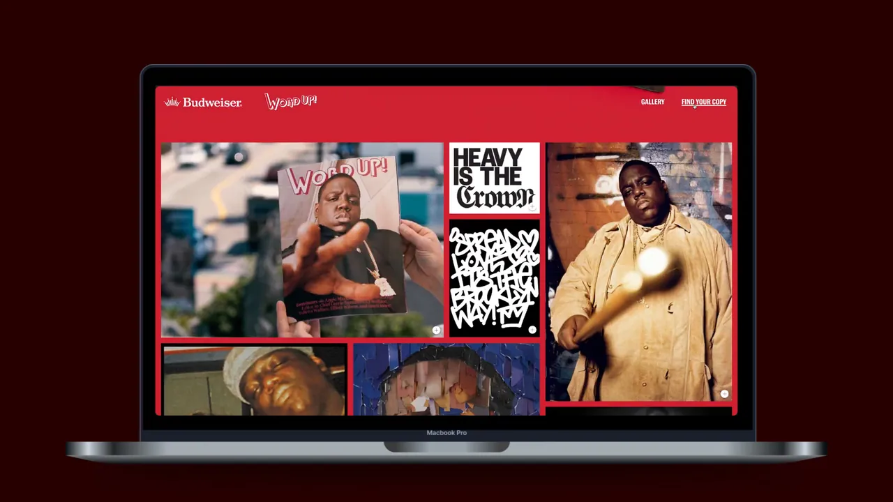 Budweiser × Biggie: laptop showing the campaign site, a red-framed grid of Notorious B.I.G. imagery with “Heavy is the Crown” artwork.